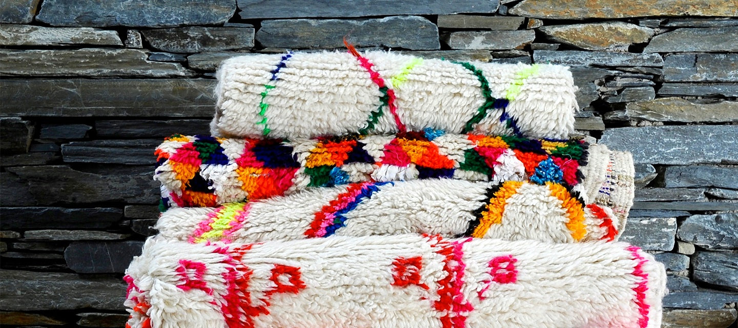 Pile of hand made Moroccan rugs